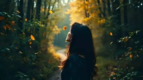 AI Video from prompt: A woman walks alone through a quiet, windy fores