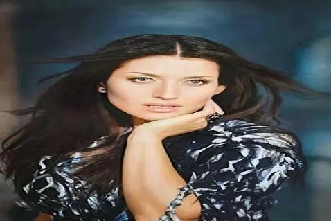 AI Video from prompt: The image is a portrait of a young woman with lo