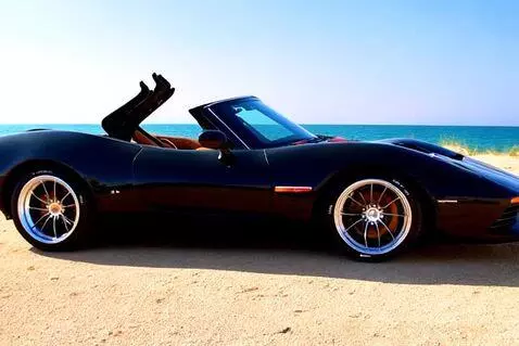 AI Video from prompt: 1997 beach sun chevrolet corvette c5 black gloss