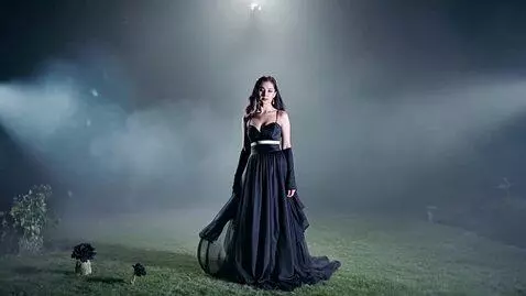 AI Video from prompt: A beautiful and seductive woman in a flowing bla