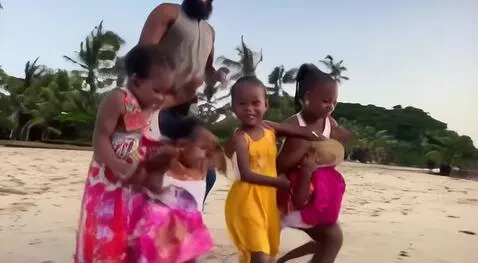 AI Video from prompt: A family of five having the most fun in ghana