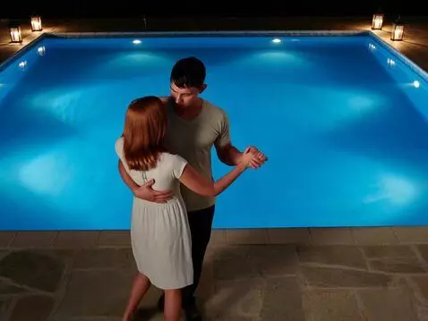 AI Video from prompt: They're dancing by the pool.