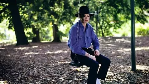 AI Video from prompt: Michael Jackson is slowly swinging on a swing