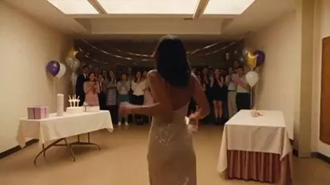 AI Video from prompt: A glamorous woman walks into a dark room when th