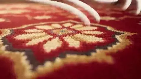 AI Video from prompt: Smooth cinematic glide over an ornate Persian ca