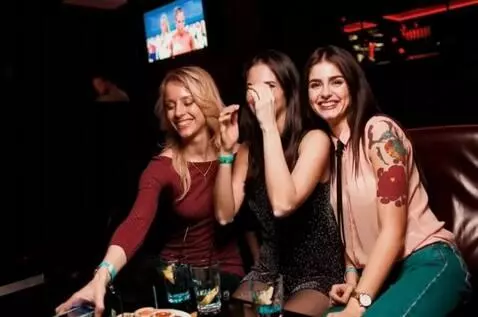 AI Video from prompt: The girls are looking at me in the camera and sm