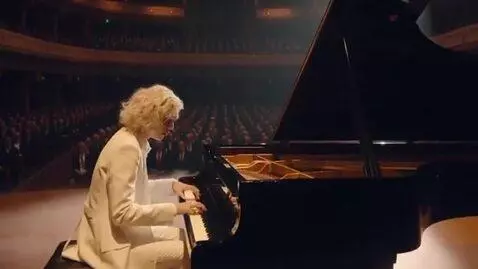 AI Video from prompt: A ethereal pianist plays classical music in an a