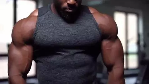 AI Video from prompt: Pecs flexing