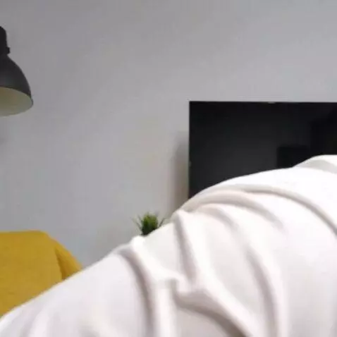 AI Video from prompt: The man on the photo stands up, goes out on the 