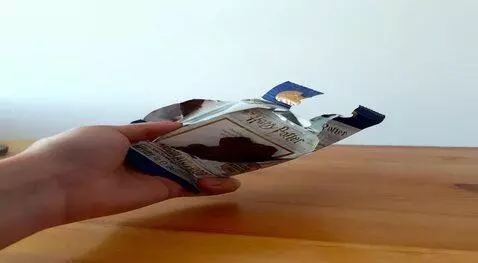 AI Video from prompt: Using the attached photo of a package with a cho