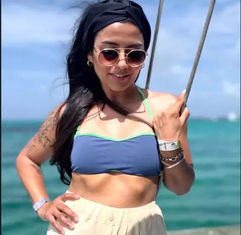 AI Video from prompt: She touches her crotch under her clothes and the