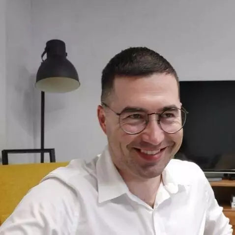 AI Video from prompt: The man on the photo stands up smiling, several 