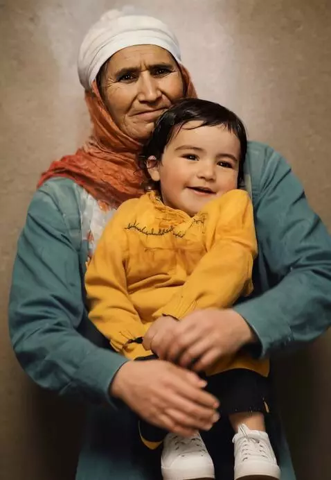 AI Video from prompt: The grandmother hug his little daughter