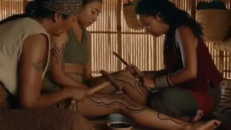 AI Video from prompt: The girl gets tribal tattoos all over her body, 