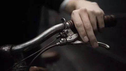 AI Video from prompt: Close-up: While riding at high speed, a hand rep