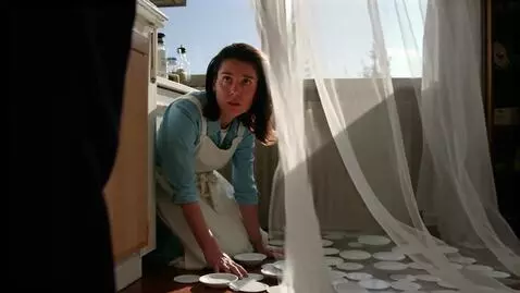 AI Video from prompt: woman in the kitchen on the floor many shards of