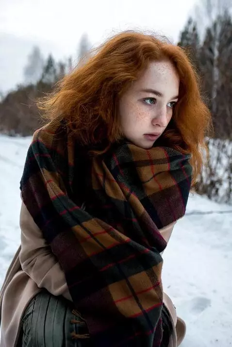 AI Video from prompt: the girl is frozen, and it starts to rain, she's