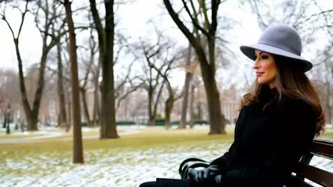 AI Video from prompt: A woman in a gray hat with brown hair, a black j