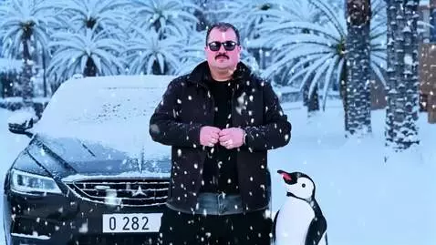 AI Video from prompt: A cinematic winter scene where the man in the im