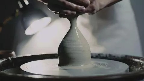 AI Video from prompt: Low-angle shot, camera fixed opposite a rotating