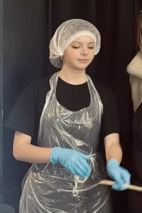 AI Video from prompt: Generate a video, where this girl is putting on 