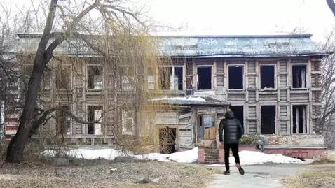 AI Video from prompt: a man enters an abandoned building