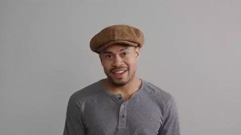 AI Video from prompt: A man tries on various hats, such as a  top hat,