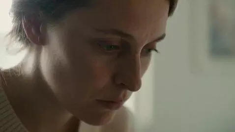 AI Video from prompt: Extreme close-up: woman's face in soft morning l