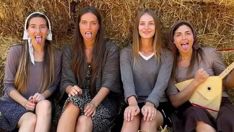 AI Video from prompt: Four girls stick out their tongues, saliva flows