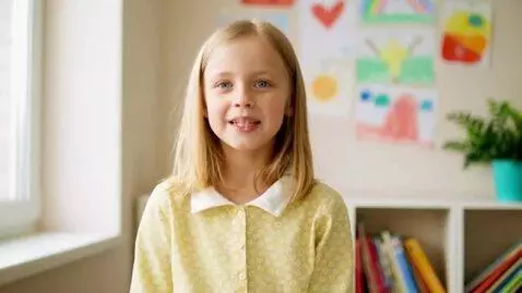 AI Video from prompt: A 9-year-old girl with blond hair in a bright cl