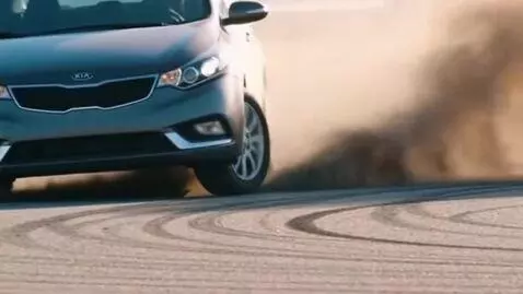 AI Video from prompt: Grey KIA Cerato 2010 model year on an asphalt ro