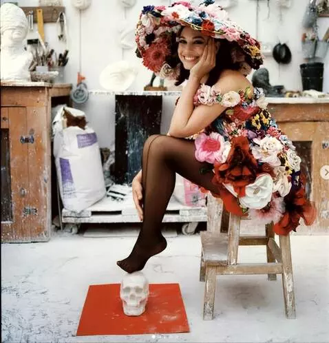 AI Video from prompt: The girl sits on the floor on her knees and smil