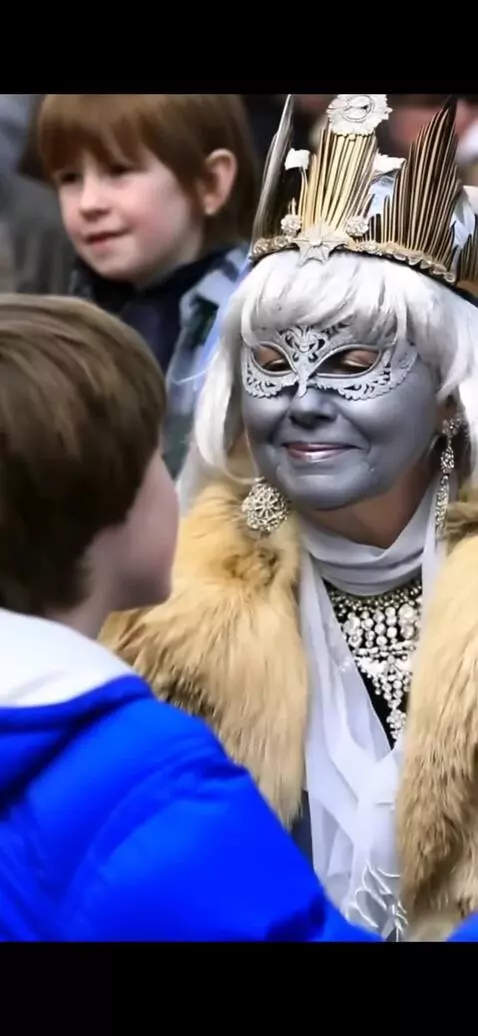 AI Video from prompt: The fifty-year-old snow queen kisses the young m