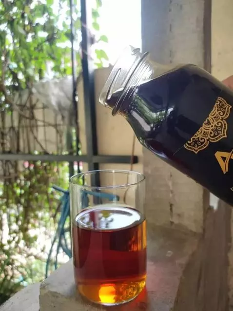 AI Video from prompt: A glass jar of forest acacia honey is gently ope