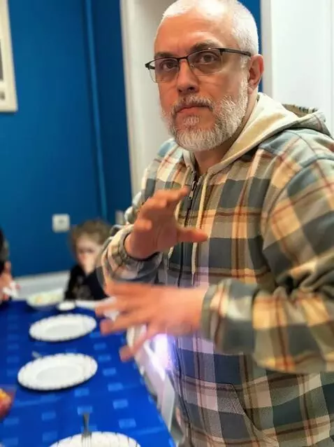 AI Video from prompt: The man on the photo stands up very serious look