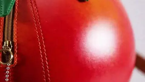 AI Video from prompt: High-definition commercial, a vibrant red tomato