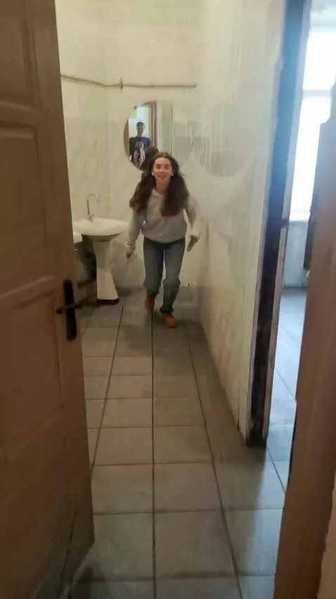 AI Video from prompt: Make her run up to me and say suck it.