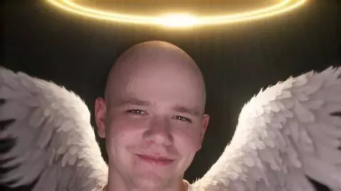 AI Video from prompt: The guy on the photo winks and smiles to the cam