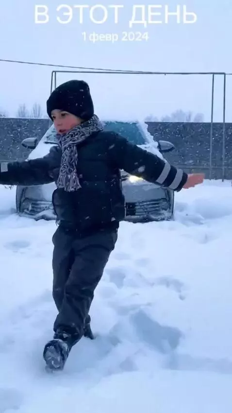 AI Video from prompt: A kid is dancing near a Lezginka car