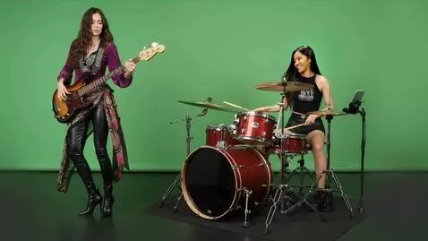 AI Video from prompt: Camera closes in on the bass player on the left 