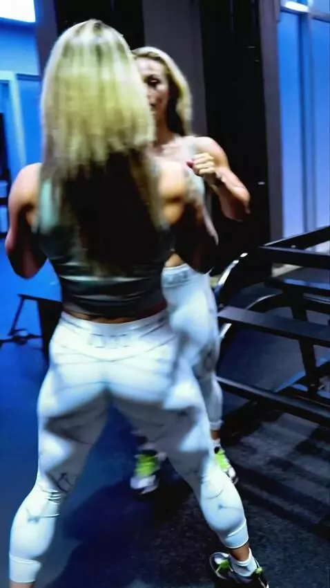 AI Video from prompt: Kickboxing girl fights her double in the ring, k