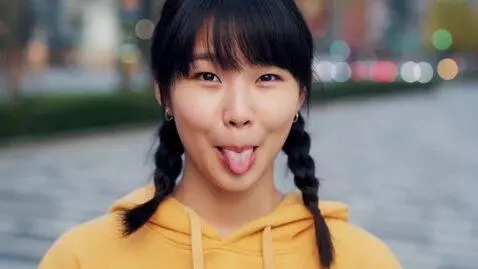 AI Video from prompt: Asian girl with tongue out and cross eyed