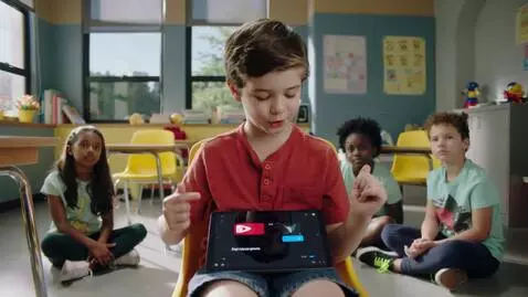 AI Video from prompt: "A cute 8-year-old boy sitting in a colorful cla