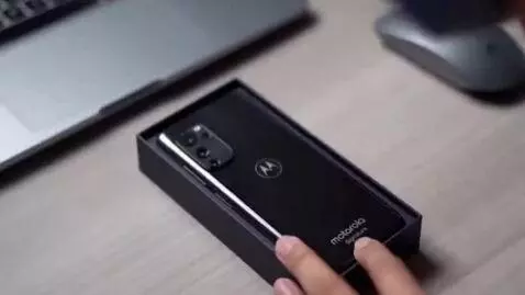 AI Video from prompt: Create a vertical 9:16 cinematic unboxing video 