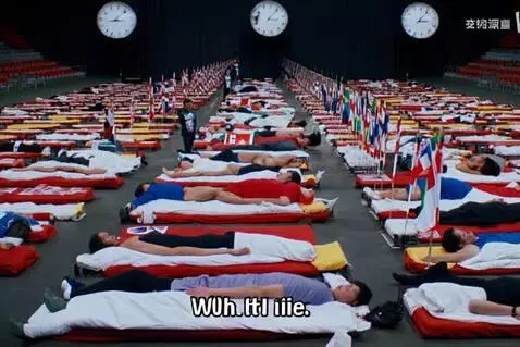 AI Video from prompt: A massive indoor hall filled with rows of beds. 