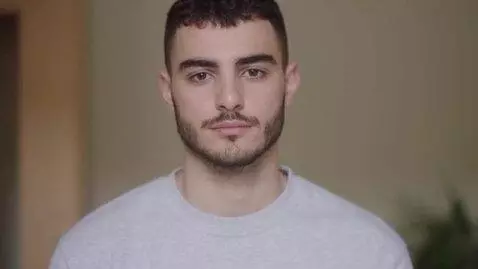 AI Video from prompt: Ultra-realistic video of a 24-year-old man, natu