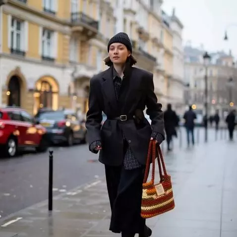 AI Video from prompt: A girl running along the sidewalk, the wind play
