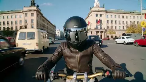 AI Video from prompt: USSR, 1970. High-speed motorcycle riding through