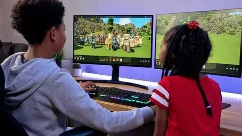 AI Video from prompt: They're playing computers and they're playing a 