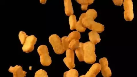 AI Video from prompt: Chicken nuggets fallont from top to the bottom